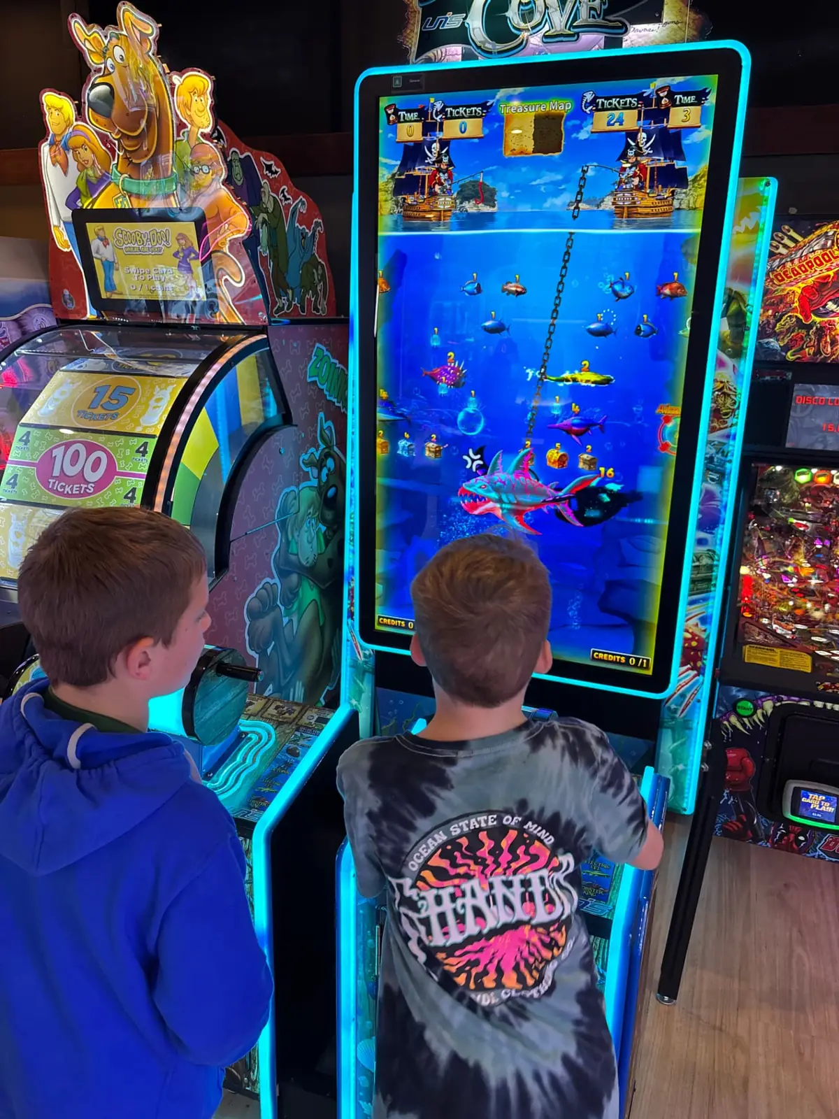Two children playing an arcade game together at Bendigo Bowl