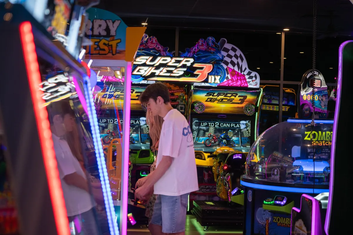 Superbike racing cabinets on the arcade floor at Bendigo Bowl