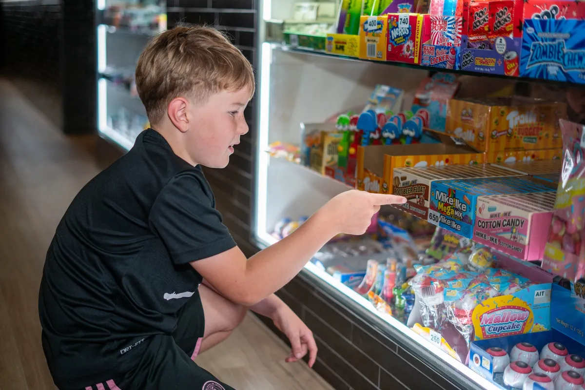 Prize counter stacked with ticket-redemption rewards at Bendigo Bowl
