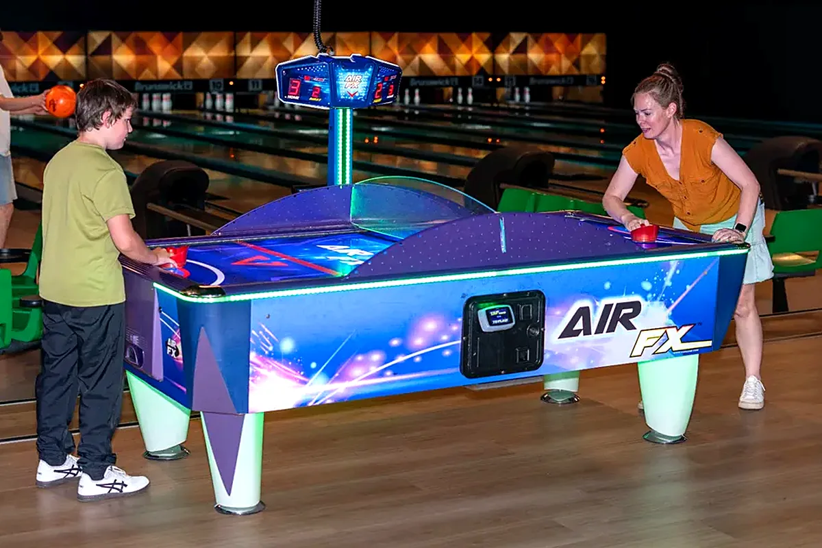 Air hockey table in action in the Bendigo Bowl arcade