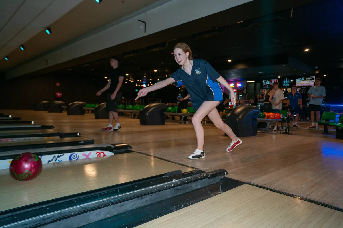 A bowler mid-delivery on a Bendigo Bowl lane